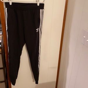 Adidas joggers. High waisted. Slim fit on the calves. Has pockets.